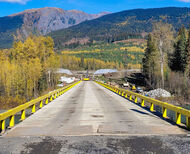 A newly constructed bridge surrounded by fall foliage in Northern B.C.