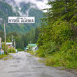 The welcome sign hanging above the only street entering Hyder, Alaska.