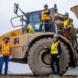 Tahltan equipment operators with an articulating truck used in mining.