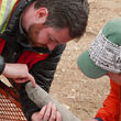 Geologists inspect core from drilling a Northern BC gold-silver prospect.