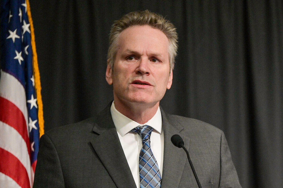 Governor%20Mike%20Dunleavy%20delivering%20a%20speech%20in%20front%20of%20American%20flag%2E