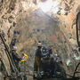 Underground miners working at the face of the Enserch tunnel at Lucky Shot.