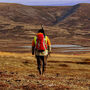 Workers backpack across Pebble copper gold mine project Alaska