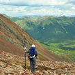 Geologist surveying the hills around Snowline Gold's Rogue property.