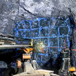 A jumbo drills an underground mining face for blasting at Big Missouri.