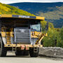 A Cat mining haul truck travels between the Gil gold deposit and Fort Knox mill.