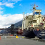 A conveyor loads copper concentrates into a ship berthed at the Skagway port.