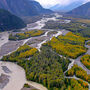 A braided section of the Taku River runs alongside fall foliage in Northern BC.