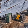 Aerial view of drill testing for gold in a mountainous area of Alaska.