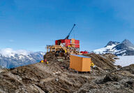 A drill rig tests for gold from a mountain ridge in Northern British Columbia.