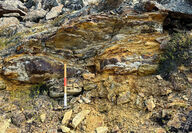 A highly colorful multi-layer outcrop from Blue Star's Penthouse prospect.