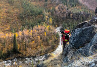 A Tectonic geologist scales a steep slope while exploring for gold in Alaska.