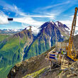 A drill perched on the side of a mountain tests for metals in SE Alaska.