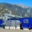 A modular assay lab constructed from several blue shipping containers.