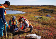 Blue Star geologists collect a sample during gold exploration in Nunavut.