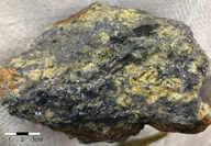A large chunk of galena or lead, with crystalline sphalerite or zinc on it.