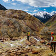 Workers hiking up an outlying rock formation at Seabridge Gold's KSM property.