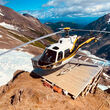 Helicopter on a drill pad near the Cambria Icefield in British Columbia, Canada.