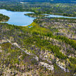 An exposed outcrop surrounded by lakes in NWT, Canada.