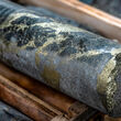 Bands of metallic copper-gold mineralization in core from Red Chris drilling.