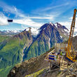 A drill tests for high-grade VMS mineralization from a mountainside at Palmer.