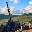 Drill and truck at road accessible Klaza gold silver project Dawson Range Yukon
