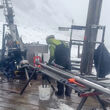 A driller tests for gold as the first 2022 snow coats the ground at Estelle.
