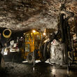 An underground miner and drill at the Greens Creek silver mine in Alaska.