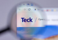 Magnifying glass on the Teck Resources logo displayed on a computer screen.