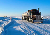 A tanker truck delivers diesel over a winter ice road in Nunavut.