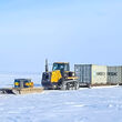 A snow train transporting fuel and drill materials to Ferguson Lake, Nunavut.