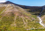Photo of a mountain with roads built to drill the Caribou Dome copper deposit.