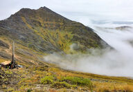 Drill on mountain ridge above the clouds, tests the Arctic Mine deposit in AK.