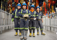 Agnico Nunavut Meliadine mine workers with gold bar Covid 19
