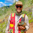 VP Exploration Adam Coulter holds chunk of copper-rich rock from Catch.