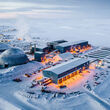 Aerial view of a large Canadian Arctic mining complex during the winter.
