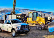 Drill rig dozer truck at Peak Gold deposit Tetlin Alaska Contango Royal JV