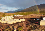 Rainbow next to a large Quonset tent camp on Alaska’s Seward Peninsula.