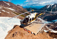 Helicopter on a drill pad near the Cambria Icefield in British Columbia, Canada.