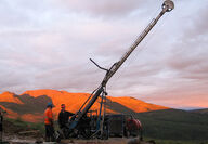 A drill rig backset by a gorgeous sunset in Yukon, Canada.