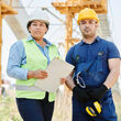 Male and female industrial employees working on a jobsite.