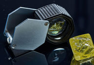 A geologist loupe and yellow diamond recovered from the Gahcho Kué Mine.