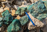 Rocks from the Storm project in Nunavut stained green from copper oxidization.