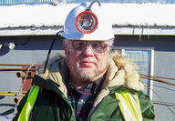 Alaska mining lawyer J. P. Tangen in hardhat and parka.