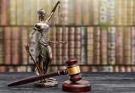 Lady Justice next to a gavel, symbolizes risky nature of EPA's Pebble decision.