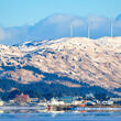 Massive wind turbines on a mountain on Kodiak Island, Alaska.