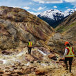 Workers traverse a highly mineralized rock outcrop at the KSM Mine project.