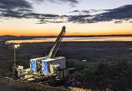 A drill tests world-class Graphite Creek deposit at sunset in western Alaska.