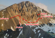 Arrows point to where high-grade gold samples were collected on steep mountain.