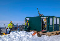 Drill rig set up on flat snow-covered land tests for copper at Storm project.
